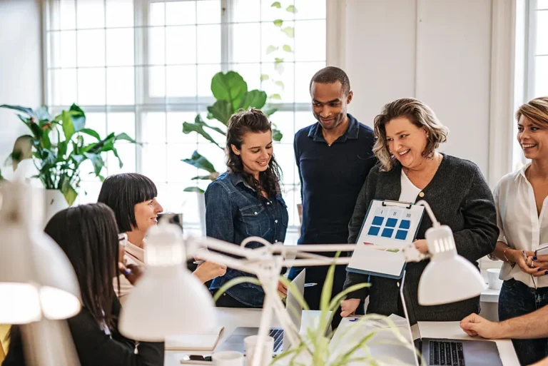 HR professional using AI-powered HRIS dashboard to manage global workforce data